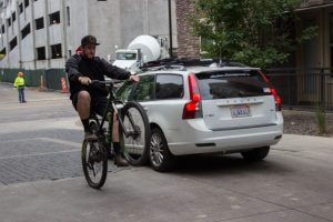 Jimmy Yoder shows off his biking skills by pops a wheelie.