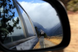 The mountains and road reflected in this car mirror represent life's journey. Photo credit: Kelly Peterson