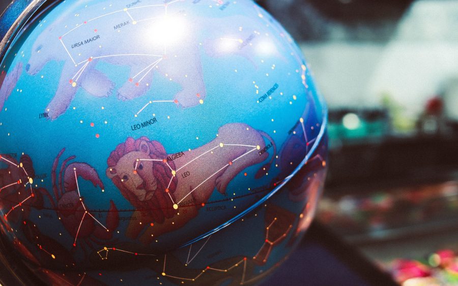 close up of globe with zodiac signs