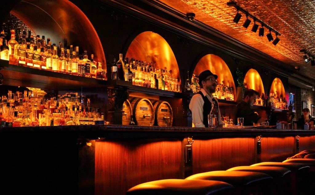 Bartender behind the bar.