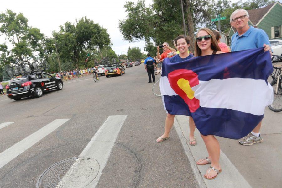 Rachel+Landin+holds+a+Colorado+flag+in+the+street