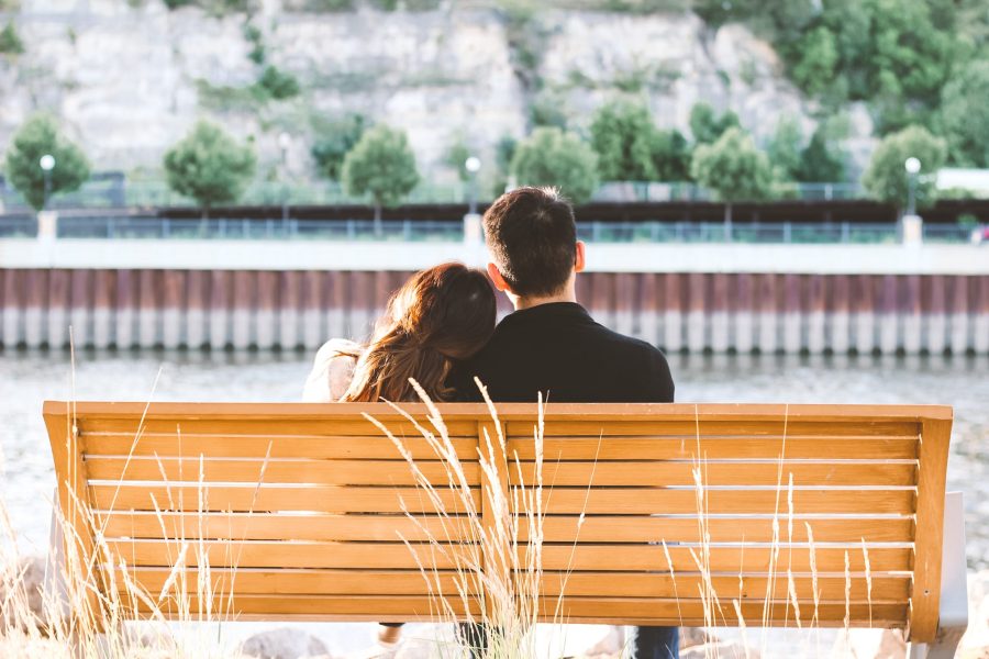 couple sitting on a park bench