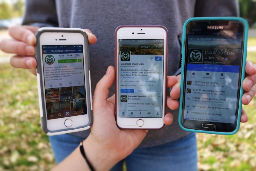 hands holding three phones with social media apps open on the screens