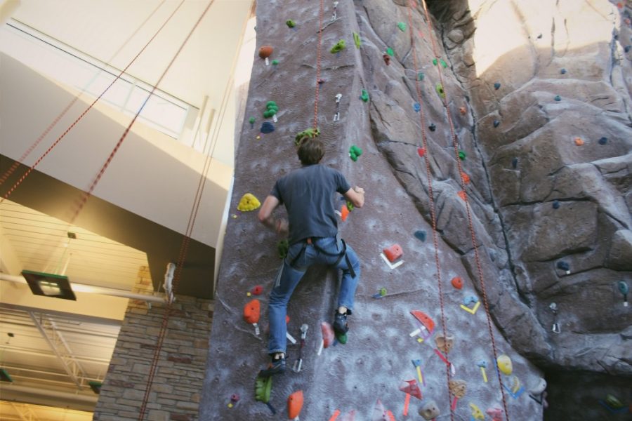 person climbing CSU rock climbing wall
