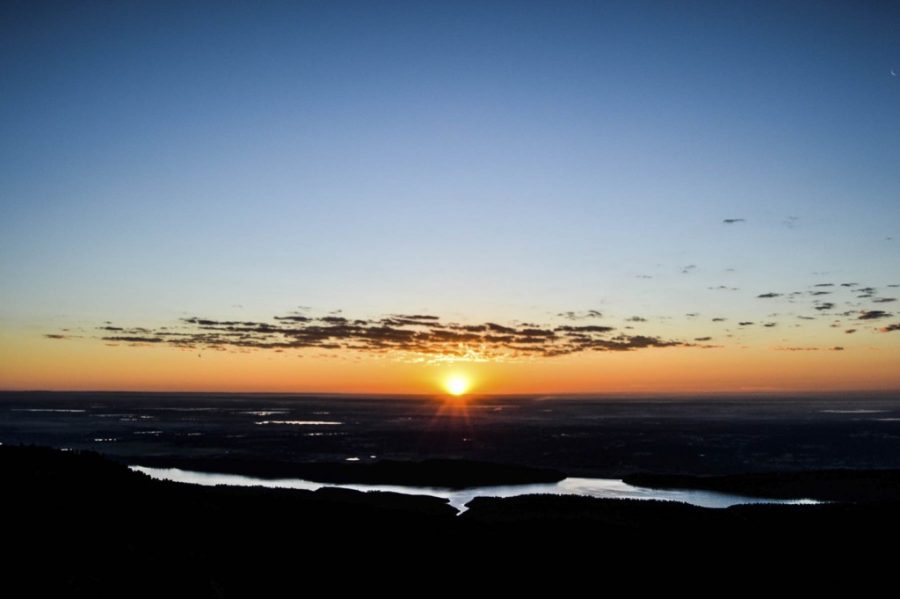 Summer 2015: The sun rises over Horsetooth Reservoir as seen from the top of Horsetooth Rock. 