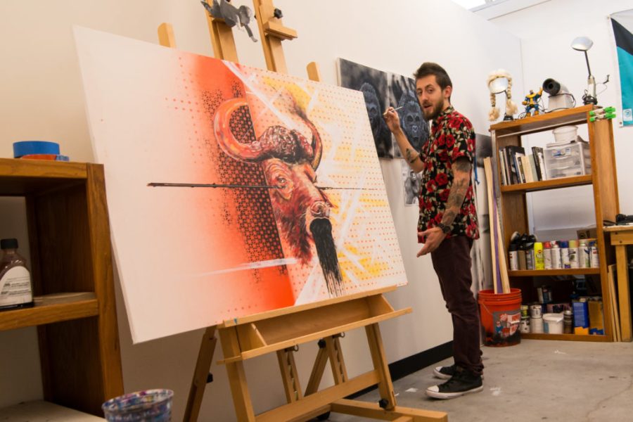 While pondering on the complex relationship between humans and animals, Adam Jones, second year graduate painting student, opens up his studio to visitors during Saturdays open house. Photo credit: Priscilla Vazquez