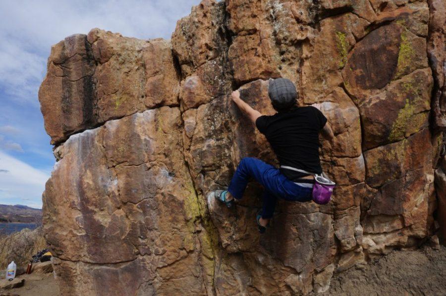 student on Horsetooth bouldering