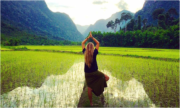 A GIVE volunteer looking off into the beautiful nature of Laos. Photo credit: givevolunteers.org