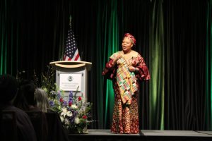 Gbowee walking the stage during her speech.