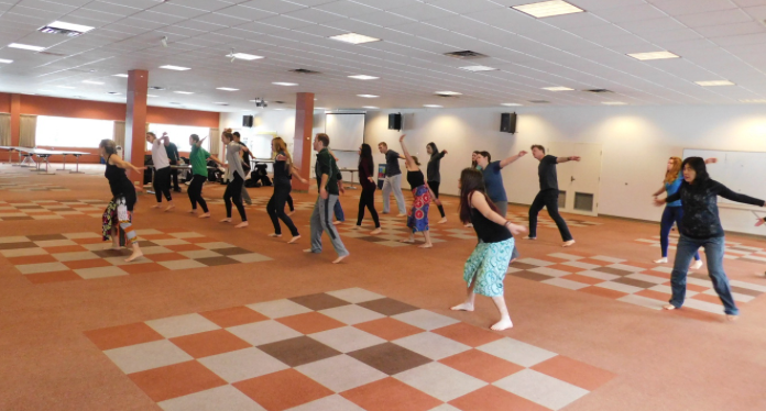 Honors students participating in West African dance.