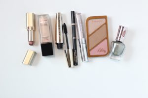 arrangement of peach and pink makeup products