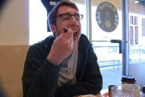 Jackson Longwell enjoys a sweet bite at The Waffle Lab.
