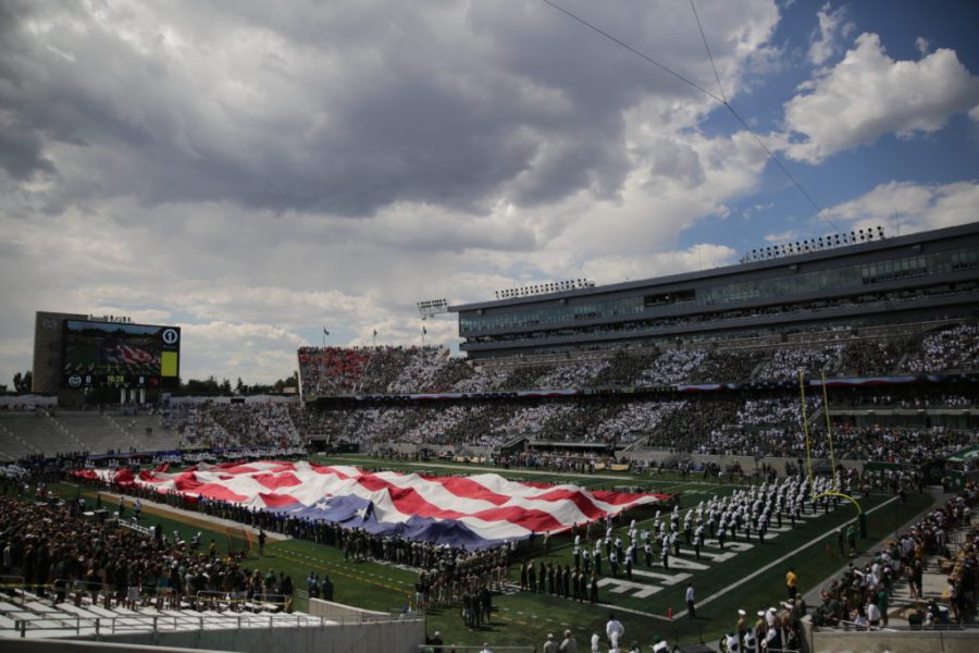 A football-field sized American flag is unfurled before the start of Colorado State Universitys first football game of the season against Oregon State, on Saturday, August 26th.