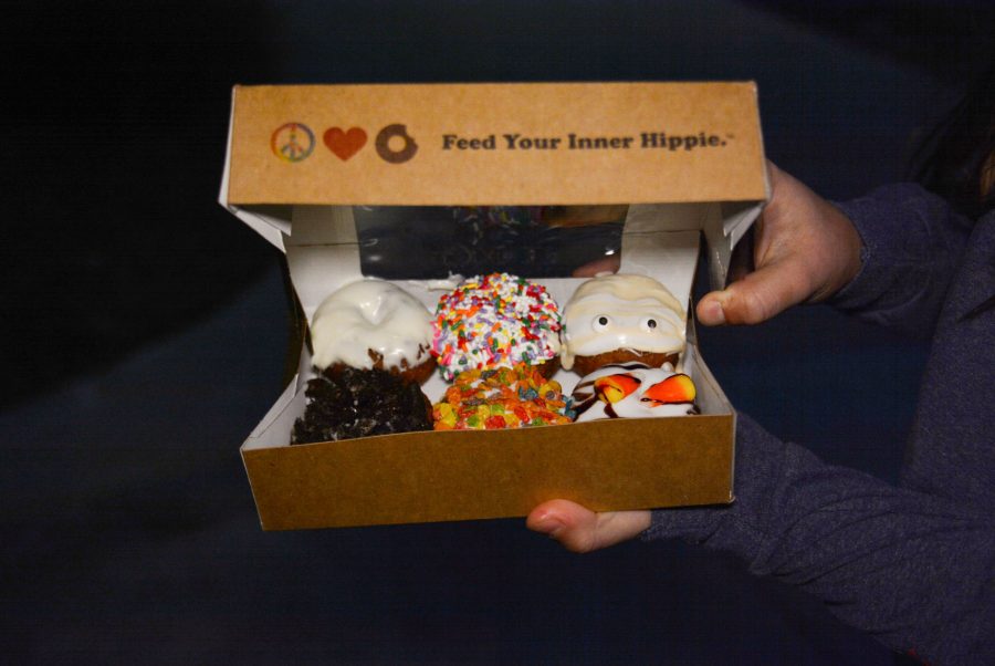 The+yummy%2C+unique+donuts+from+Peace%2C+Love+and+Little+Donuts+in+their+signature+box.+Photo+credit%3A+Mackenzie+Boltz