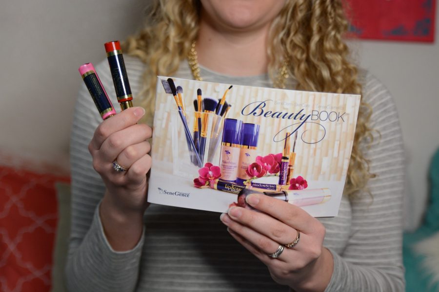 Kelsey Spognardi showing off her latest LipSense beauty book. Photo credit: Mackenzie Boltz