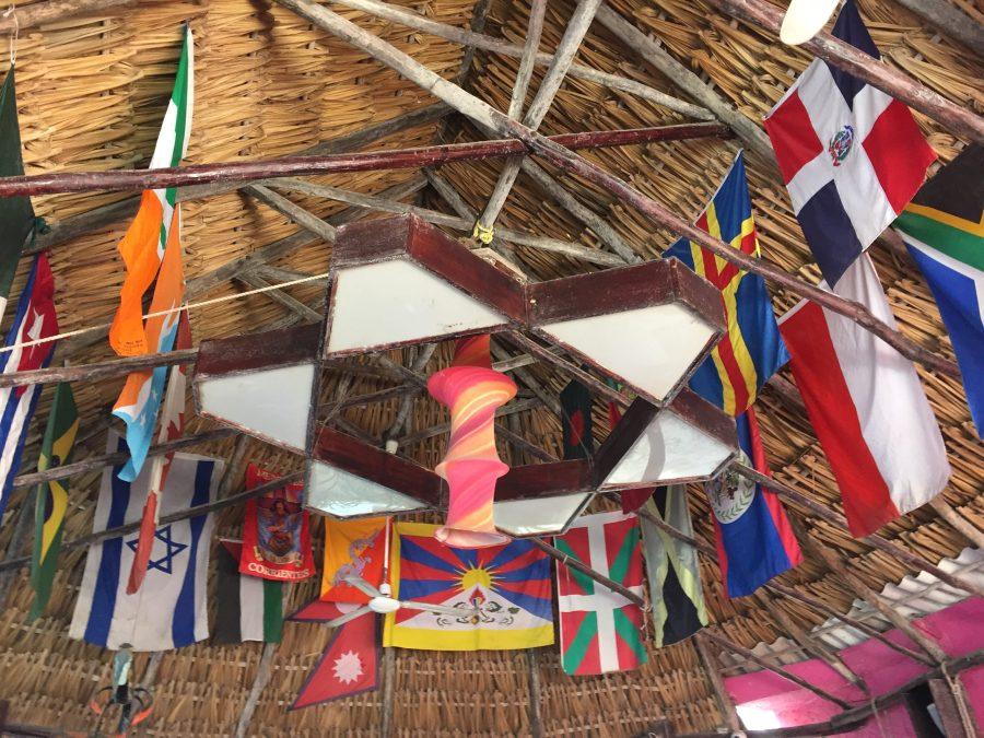Hostels are a great place to meet other travelers from all around the world. Poc-Na Hostel in Isla Mujeres, Mexico displays the flags of many different countries on the ceiling. Photo credit: Katie Mitchell
