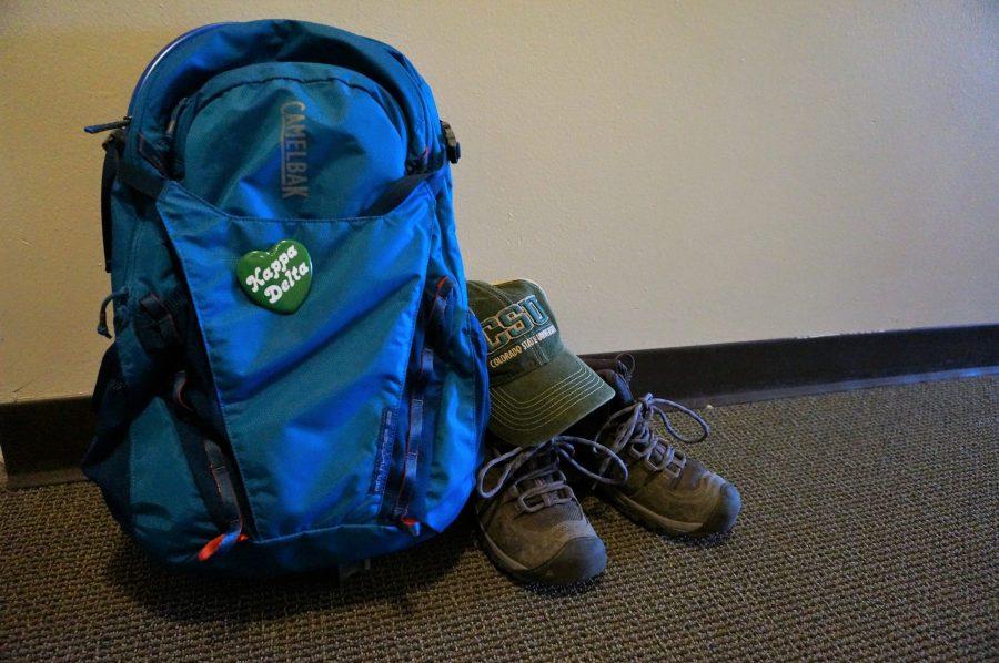 backpack, boots, and CSU cap