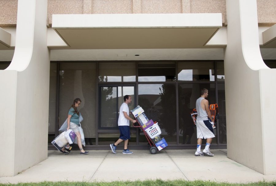 Freshman+sociology+major+Jake+Gentry%2C+right%2C+and+Parker+residents+TJ+Covillo+and+Rhonda+Gentry+move+belongings+into+the+Durward+Residence+Hall+Thursday+August+22%2C+2013.+%28Collegian+File+Photo%29