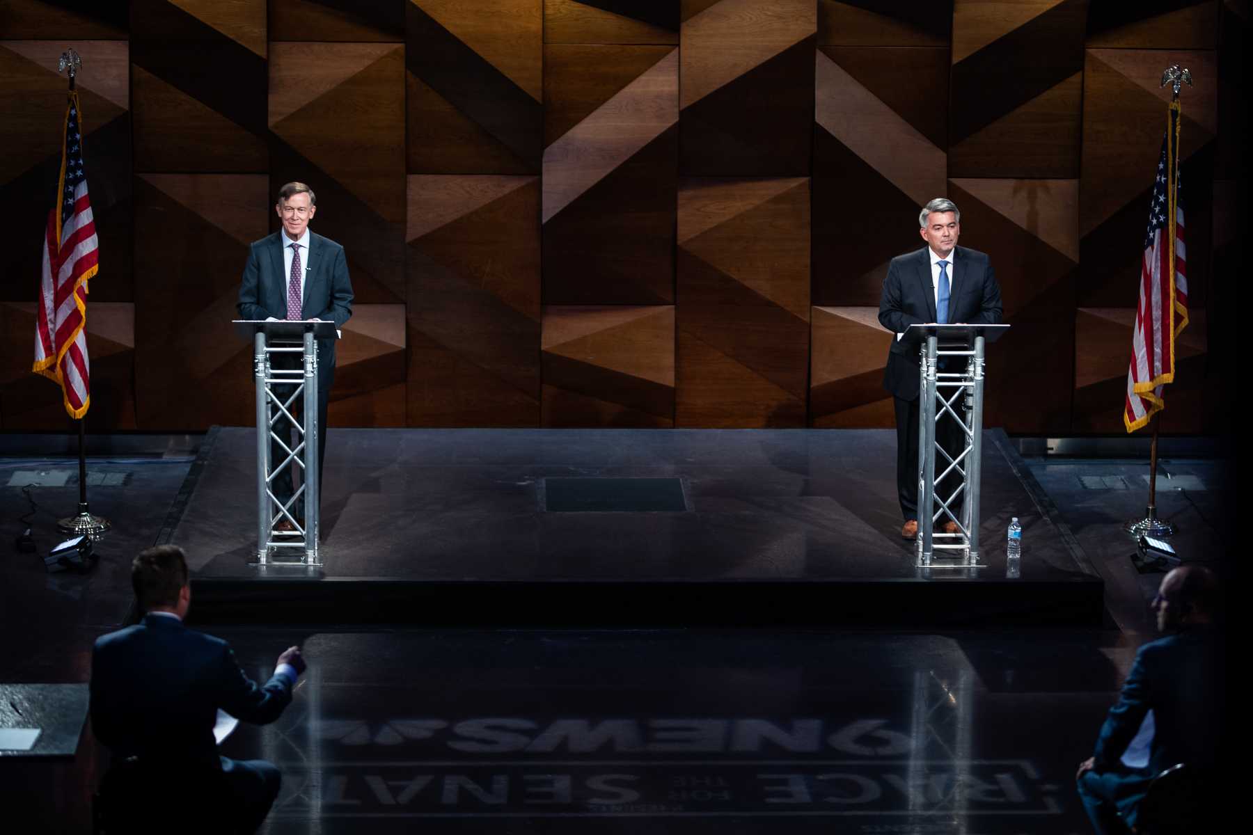 John Hickenlooper and Cory Gardner on the LSC Theatre stage for their final debate