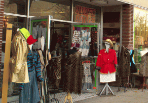 outside of a thrift store with Halloween costume displays