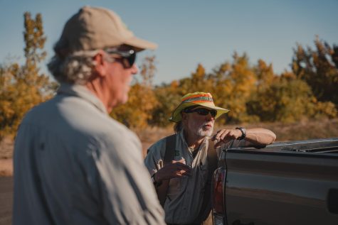 CATS volunteers talk near a truck.