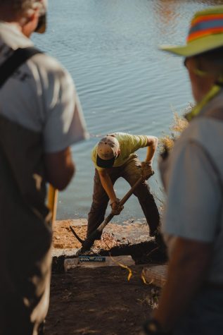 CATS volunteers work on a shore building project.