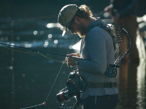 Colorado State sophomore Jack Allen puts a fly on his line.