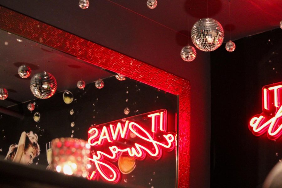 The back room at Ace Gillett’s offers a more private space with disco balls and neon signs.