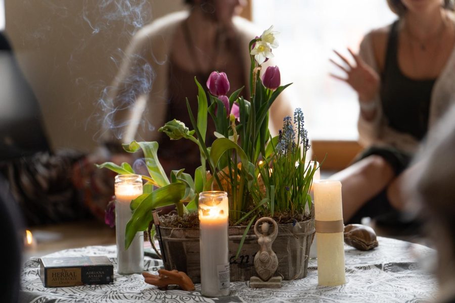 A centerpiece of flowers, incense and candles set the ambiance for the Spring Equinox Womyns Circle hosted at Golden Poppy Herbal Apothecary March 22.