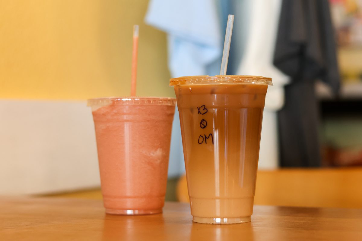 A coffee and a smoothie sit on a table side by side at Momo Lolo Café, Sep. 8.