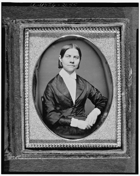 Photo of women sitting in chair.