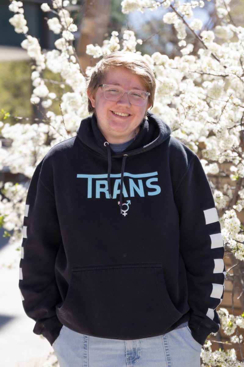 Ethan McCue smiling as spring trees start blooming at Colorado State University, Fort Collins, Colo., April 3.